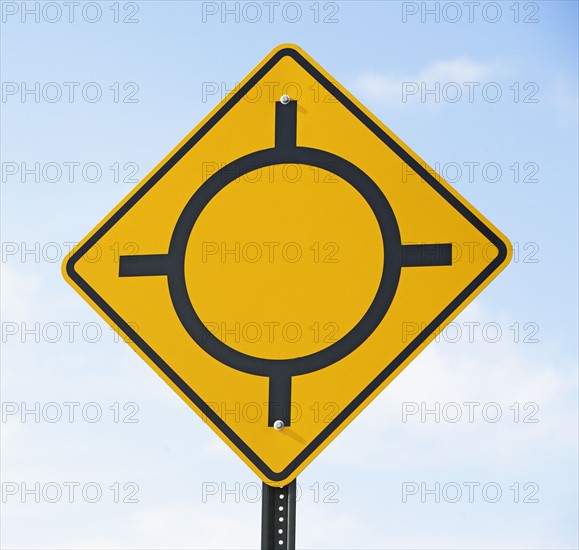 Low angle view of traffic circle sign. Date : 2007