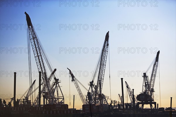 Cranes on dock at sunset. Date : 2007