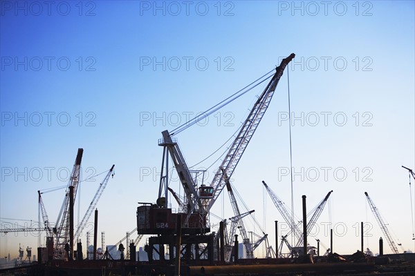 Cranes on dock at sunset. Date : 2007