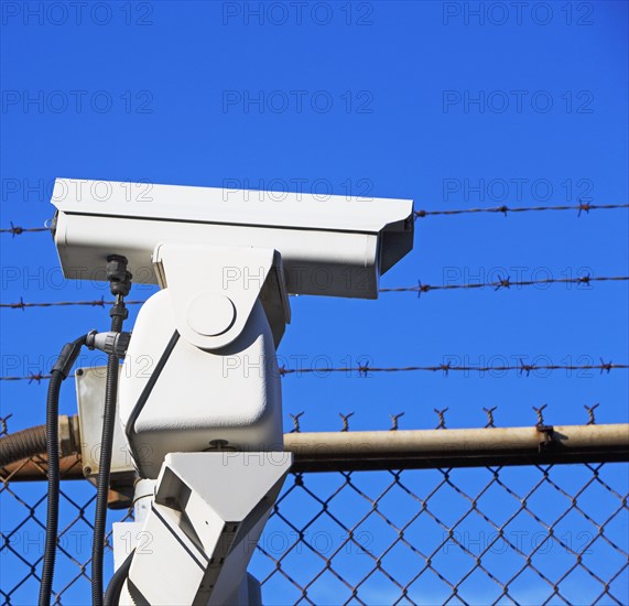 Security camera on fence. Date : 2007