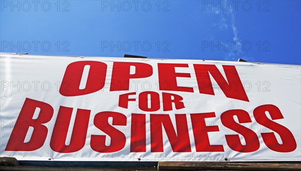 Low angle view of Open for Business sign. Date : 2007
