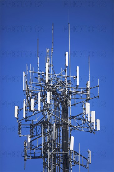 Communications tower under blue sky. Date : 2007