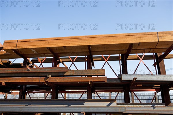 Lumber and metal stacked at construction site. Date : 2007