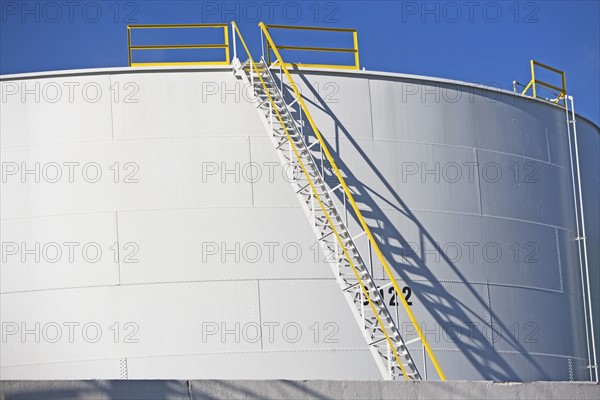 Ladder on cylindrical container. Date : 2007
