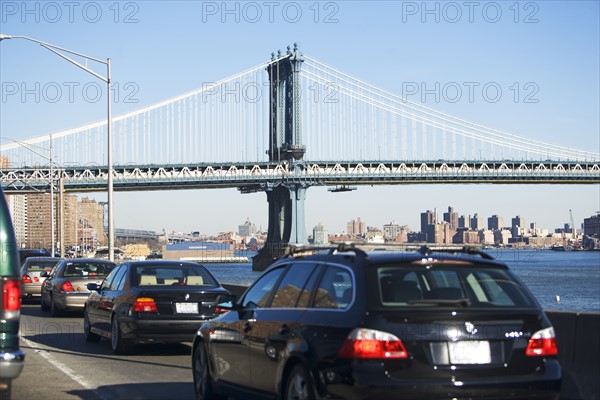 Traffic with bridge in background. Date : 2007