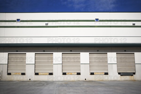 Row of closed loading docks. Date : 2007