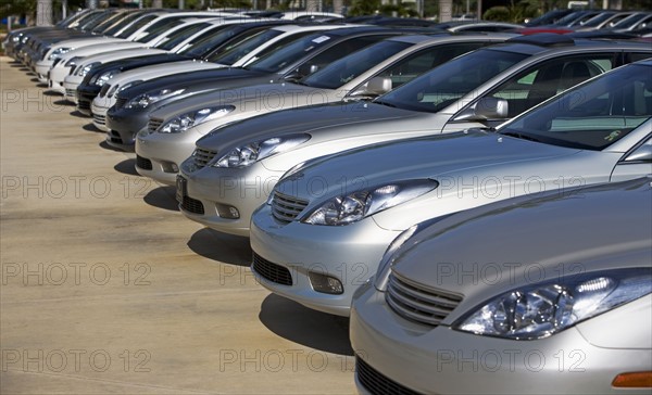 Row of new cars on lot. Date : 2007