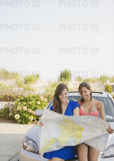 Young women looking at map. Date : 2007