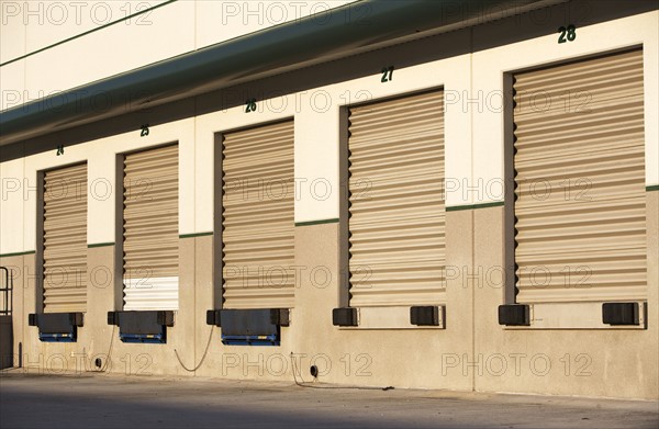 Row of closed loading docks. Date : 2007