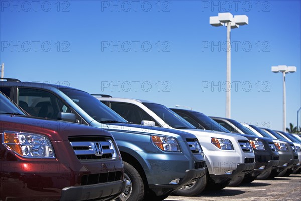 Row of new cars on lot. Date : 2007