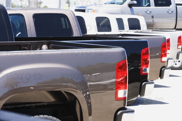 Row of new trucks on lot. Date : 2007