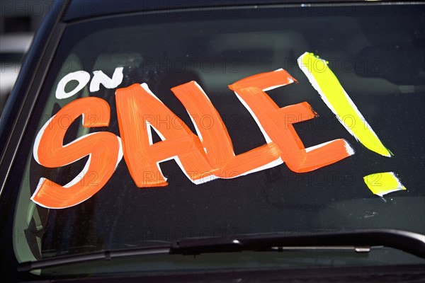 Car with On Sale on windshield. Date : 2007