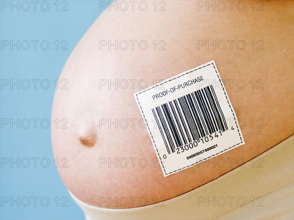 Pregnant woman’s belly with barcode. Date : 2007