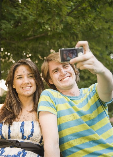 Couple taking own photograph. Date : 2007