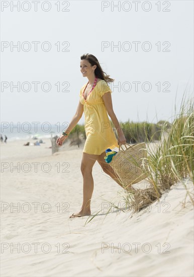 Woman walking on beach. Date : 2007