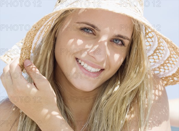 Woman wearing straw hat. Date : 2007