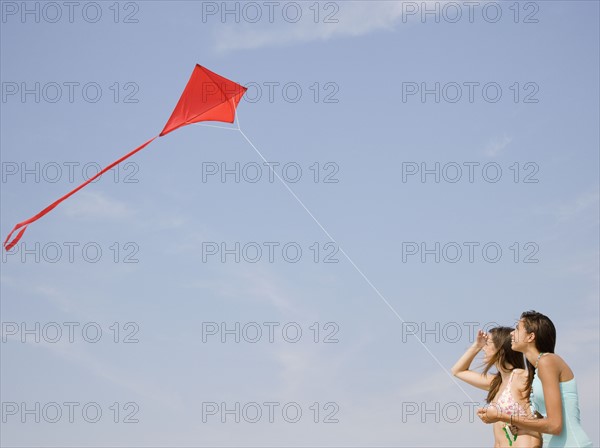 Young women flying kite. Date : 2007