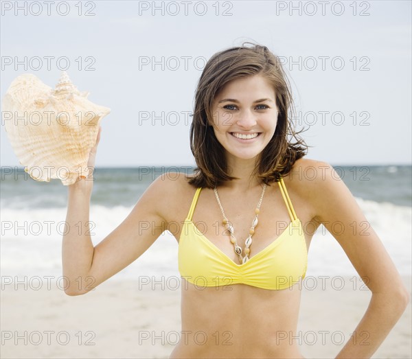 Woman holding conch shell. Date : 2007