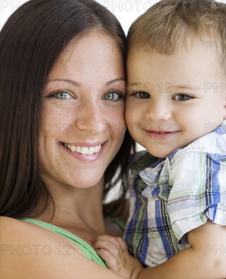 Mother hugging baby. Date : 2007