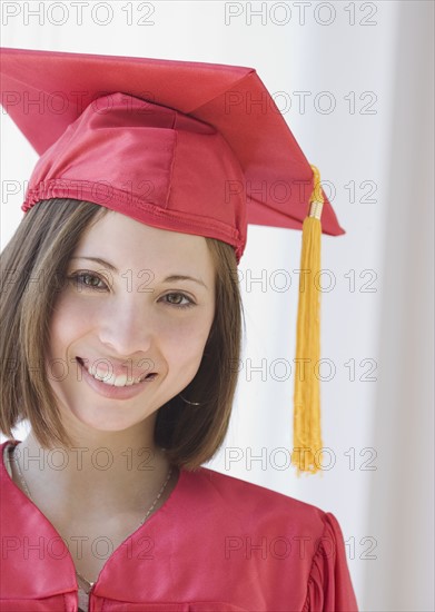 Woman wearing graduation cap and gown. Date : 2007