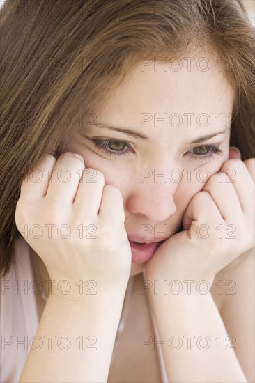 Close up of woman with head in hands. Date : 2007