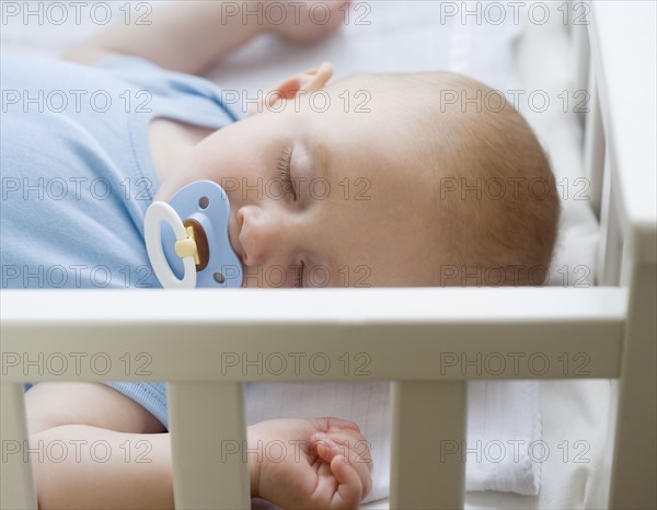 Baby sleeping in crib. Date : 2007