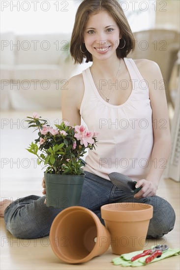Woman potting plant. Date : 2007