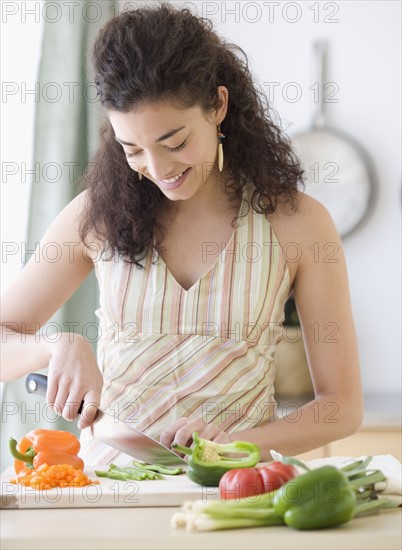 Woman chopping vegetables. Date : 2007