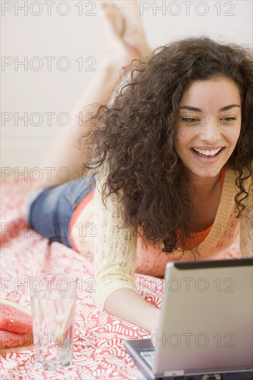 Woman typing in laptop. Date : 2007