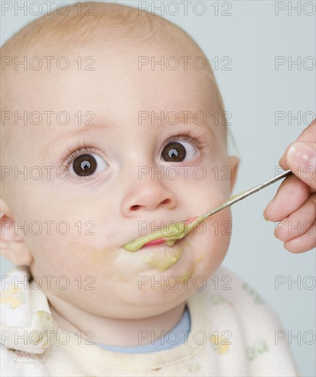 Mother feeding baby. Date : 2007