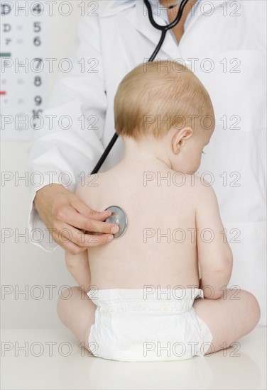 Doctor examining baby. Date : 2007