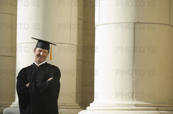 Male graduate with arms crossed. Date : 2007