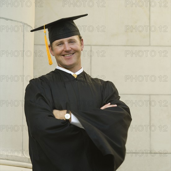 Male graduate with arms crossed. Date : 2007
