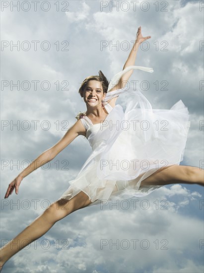 Low angle view of woman jumping. Date : 2007