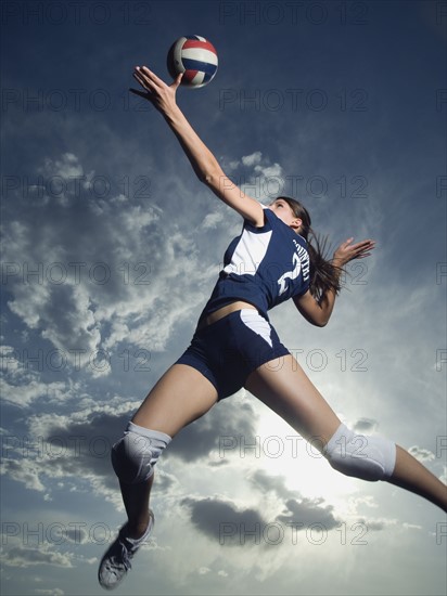 Low angle view of volleyball player jumping. Date : 2007