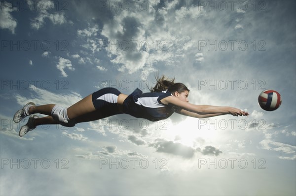 Low angle view of volleyball player jumping. Date : 2007