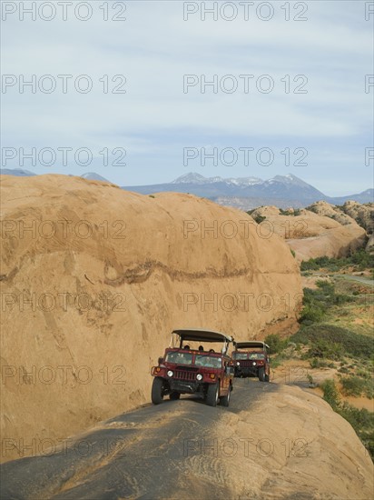 Off-road vehicles driving on rock formation. Date : 2007