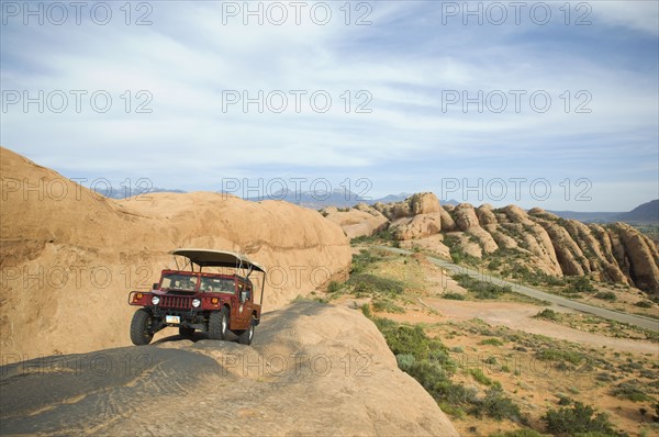 Off-road vehicle driving on rock formation. Date : 2007