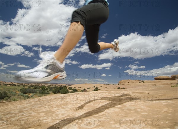 Woman jumping in desert. Date : 2007