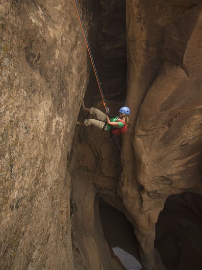 Woman canyon rappelling. Date : 2007