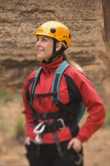 Woman wearing rappelling gear. Date : 2007