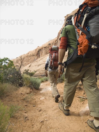 Couple hiking in desert. Date : 2007