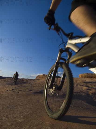 People riding mountain bikes. Date : 2007