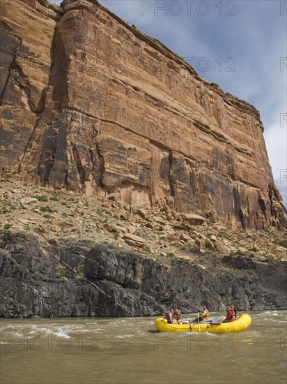 People in raft under cliff. Date : 2007