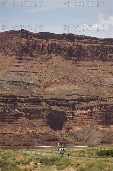 Airplane on runway in canyon, Moab, Utah, United States. Date : 2007