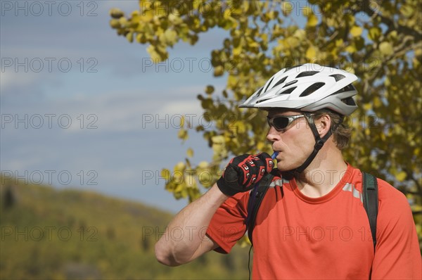 Man wearing bicycle helmet, Utah, United States. Date : 2007