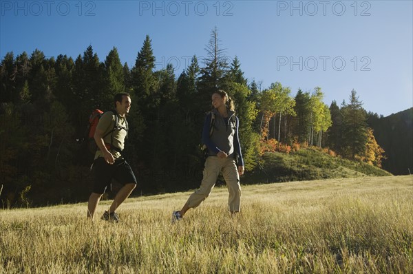 Couple hiking with backpacks, Utah, United States. Date : 2007