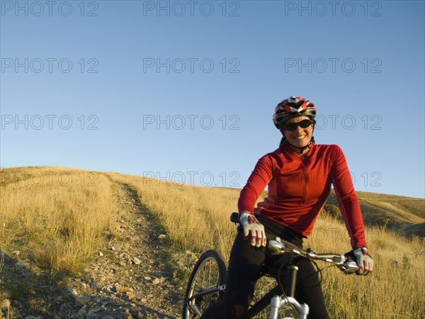 Woman on mountain bike, Salt Flats, Utah, United States. Date : 2007