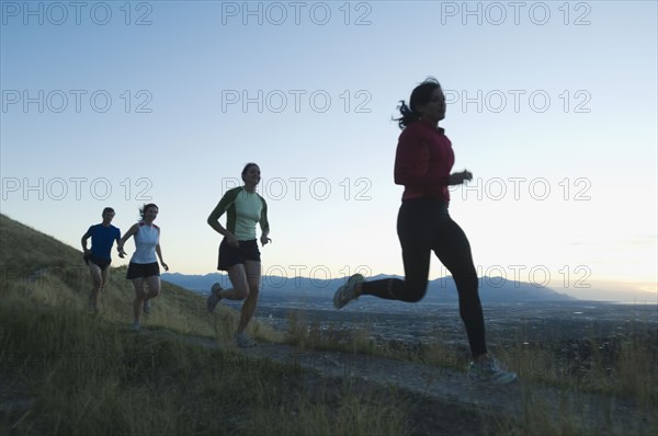 Group of people running on trail, Salt Flats, Utah, United States. Date : 2007