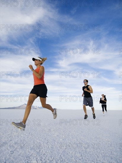 People running on salt flats, Utah, United States. Date : 2007